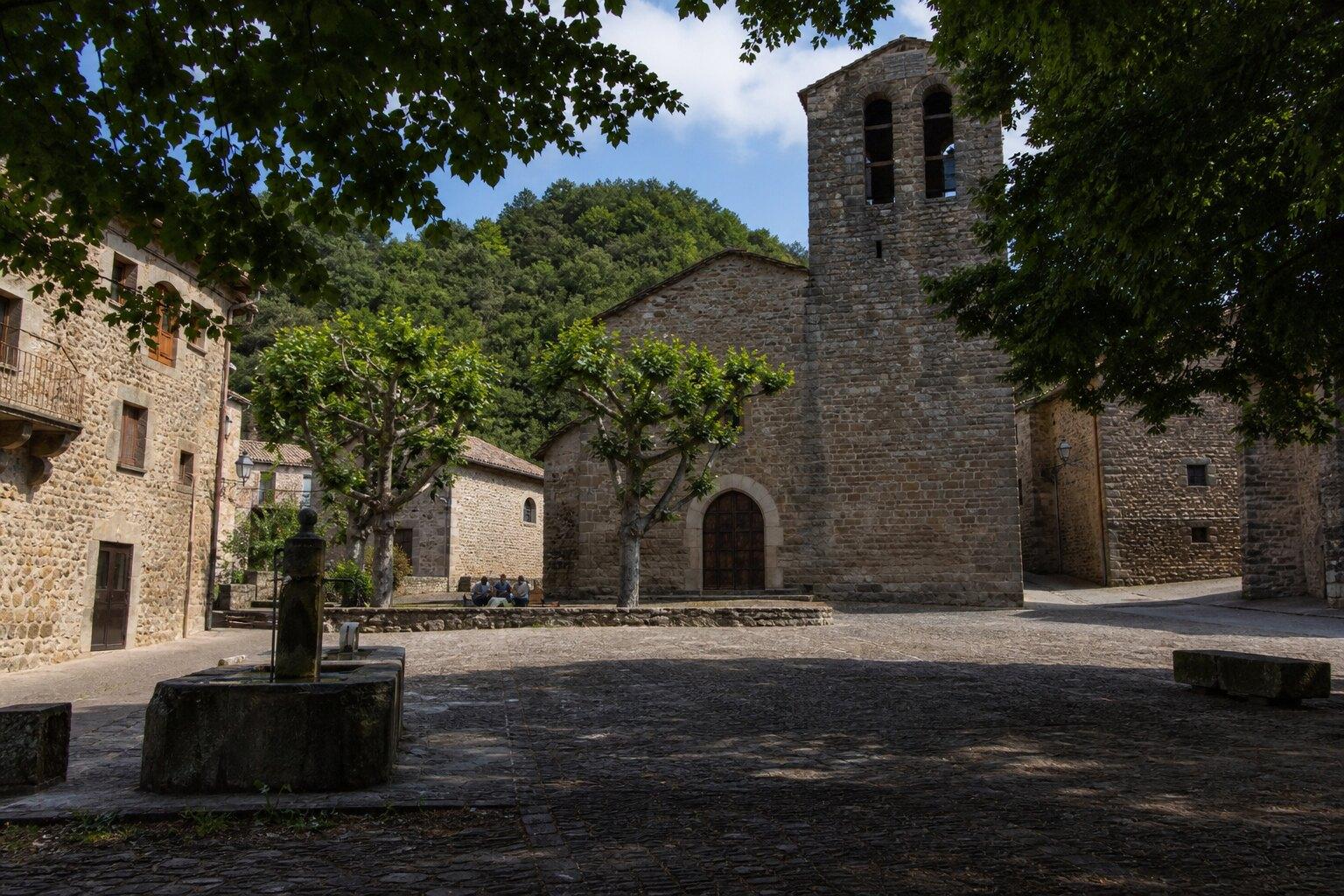 Church square in Sant Esteve d'en Bas at midday